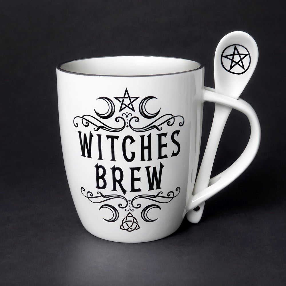 White ceramic mug with “Witches Brew” in black gothic lettering, includes matching pentacle spoon—perfect for tea or coffee rituals.
