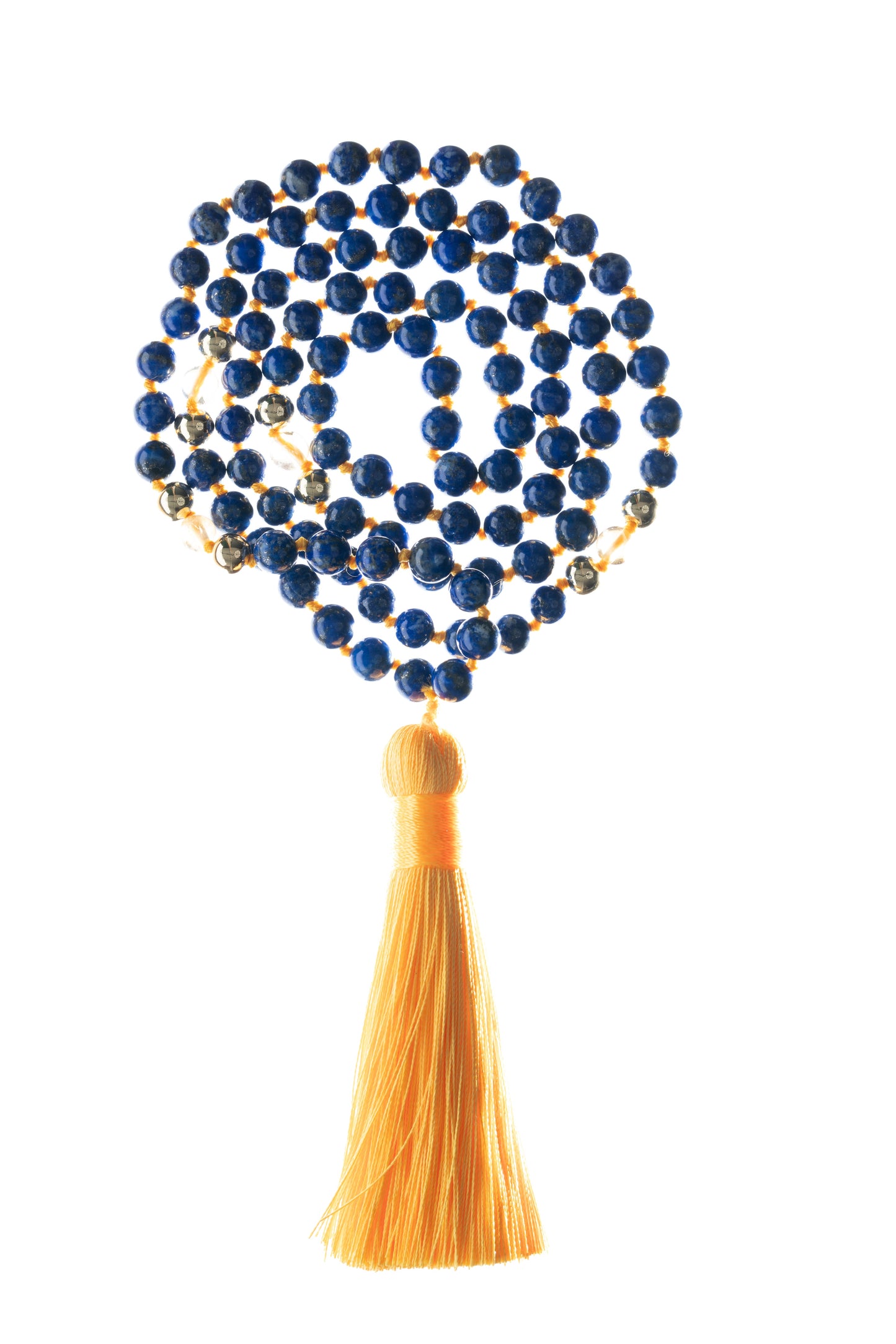 A close-up of the Lapis Lazuli & Citrine Mala beads, highlighting the vibrant blue and golden hues, laid out on a natural wooden surface.