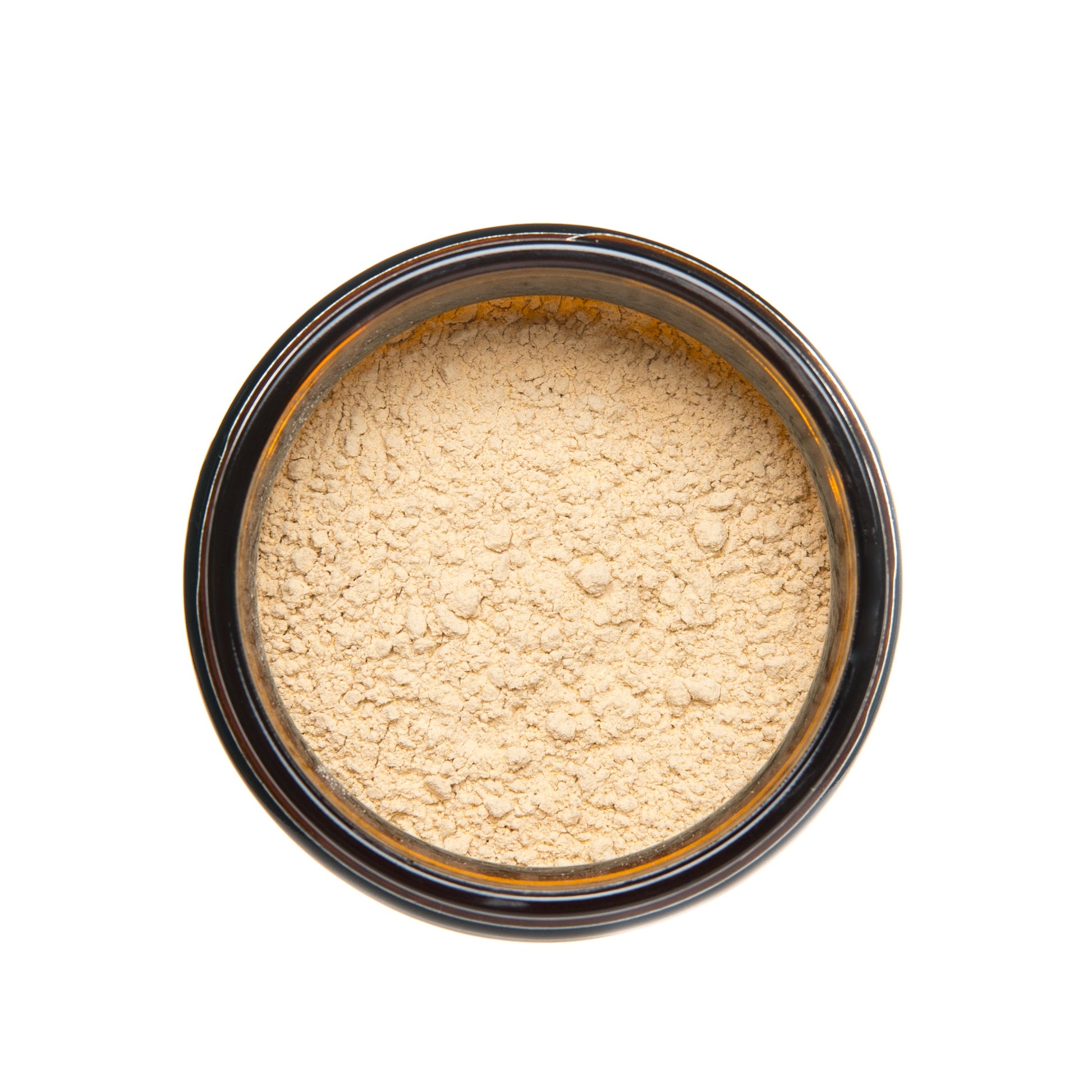 Top view of open glass jar filled with finely ground PAAVANI Ayurveda Ashwagandha root powder.
