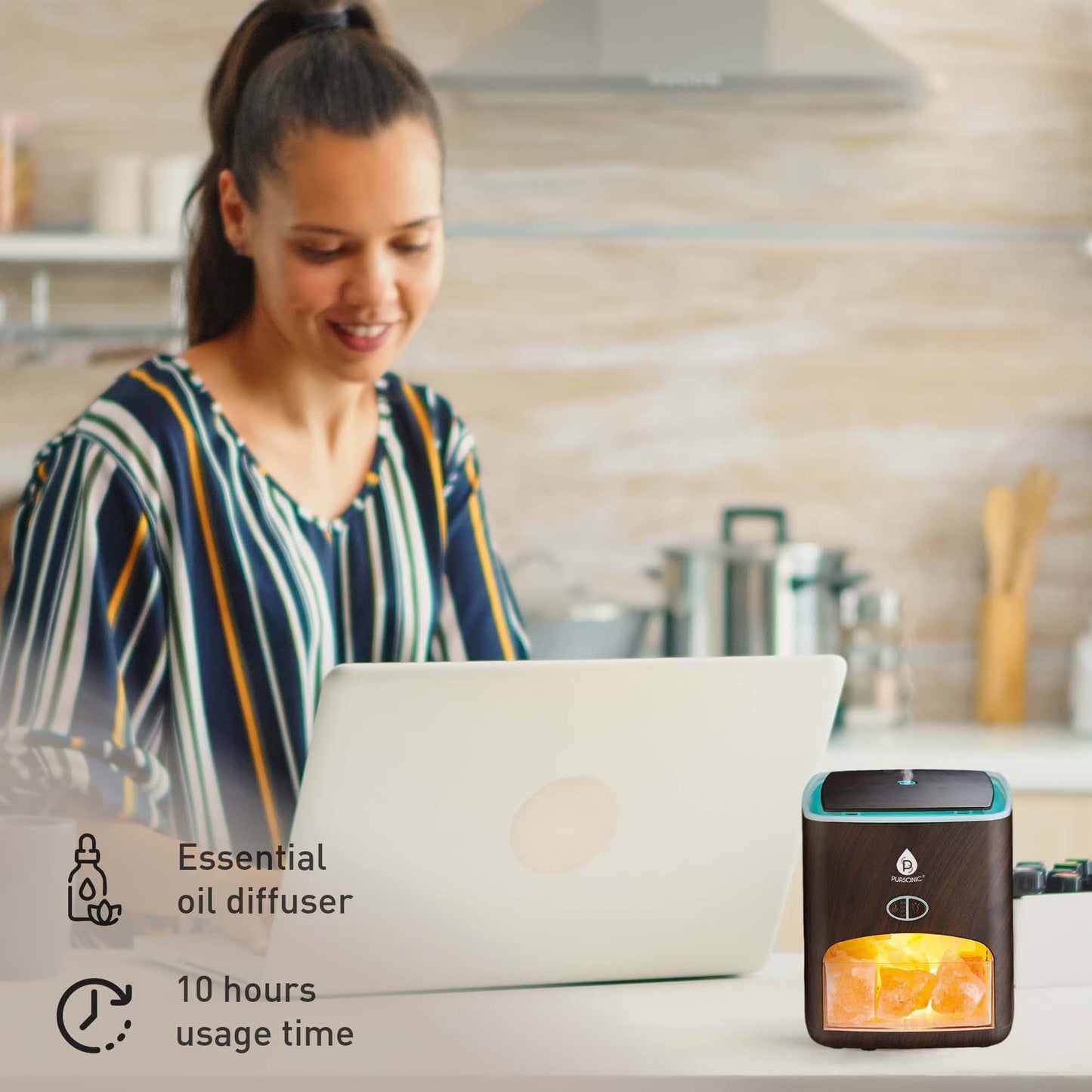 Woman working on laptop beside ultrasonic diffuser with Himalayan salt lamp, labeled with 10-hour use and essential oil icons.